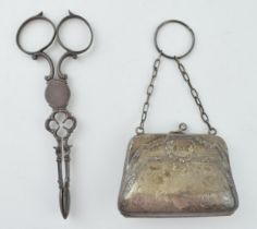 A pair of silver sugar nips, 36.2 grams, with a silver ladies purse with leather insert, gross
