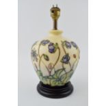 Moorcroft bulbous lampbase in the Ashwood Hepatica design, 20cm tall exc brass fitting. In good