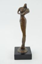 A bronze figure of mother and child in an impressionist style. Mounted on wooden base. Height