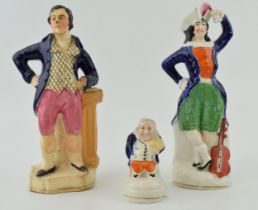 A group of Victorian Staffordshire Figures, including a lady with violin, tallest 21cm (3). In