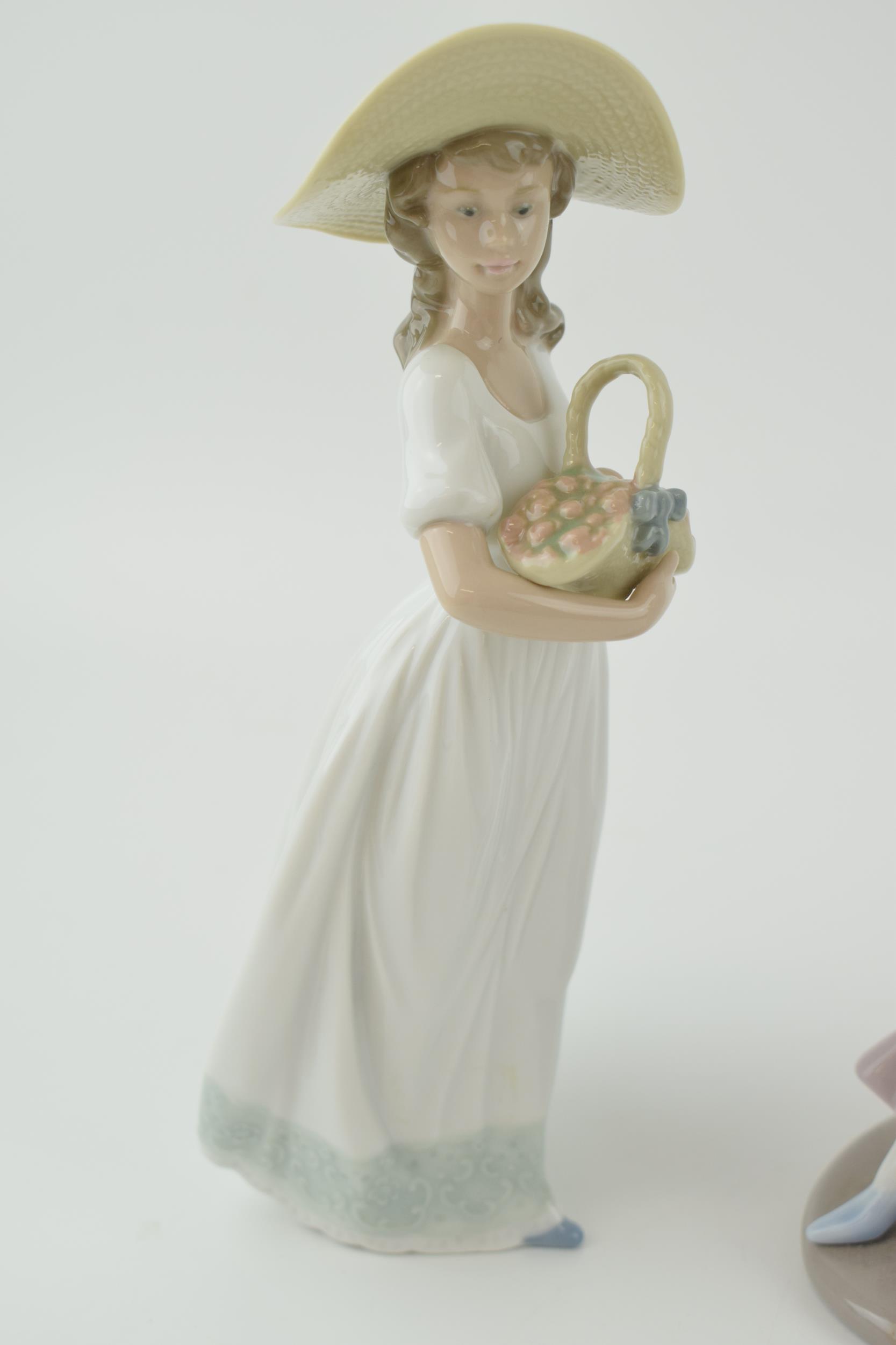 Nao figures to include a girl in a purple dress a girl with a basket of flowers and a girl holding a - Image 4 of 4