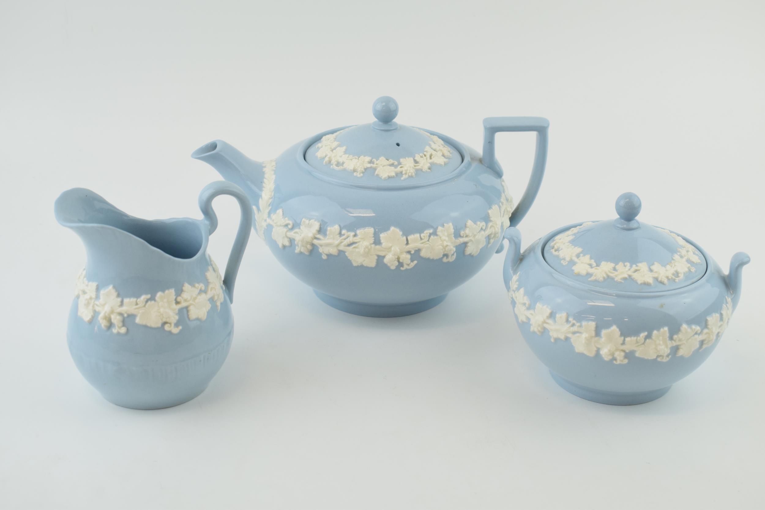 Wedgwood Queensware to include a teapot, a lidded sugar jar and a milk jug (3). In good condition