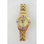 Ingersoll 100M water resistant lady's quartz watch, stone set bezel, untested, gilt bracelet.