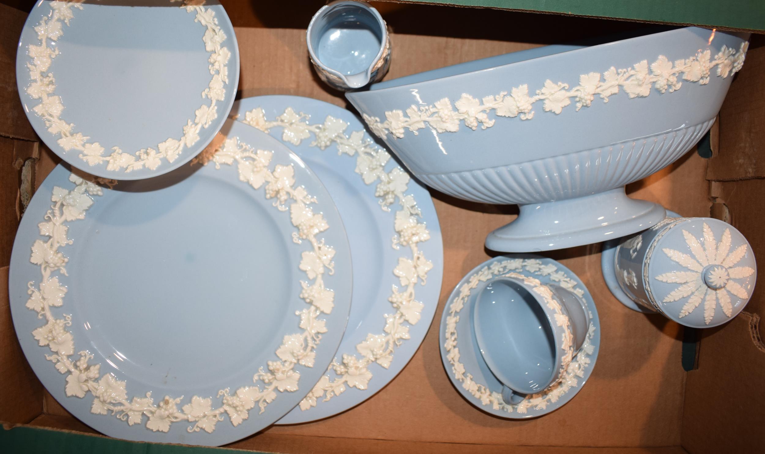 Wedgwood Queensware, white on blue, to include a tea cup and saucer, 2 dinner plates, a tazza, a