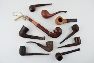 A collection of vintage tobacco smoking pipes to include briar examples by 'I R Navy, 'Clifton'