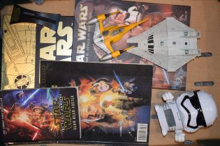 A collection of Stars Wars collectables and ephemera to include books and publications together with