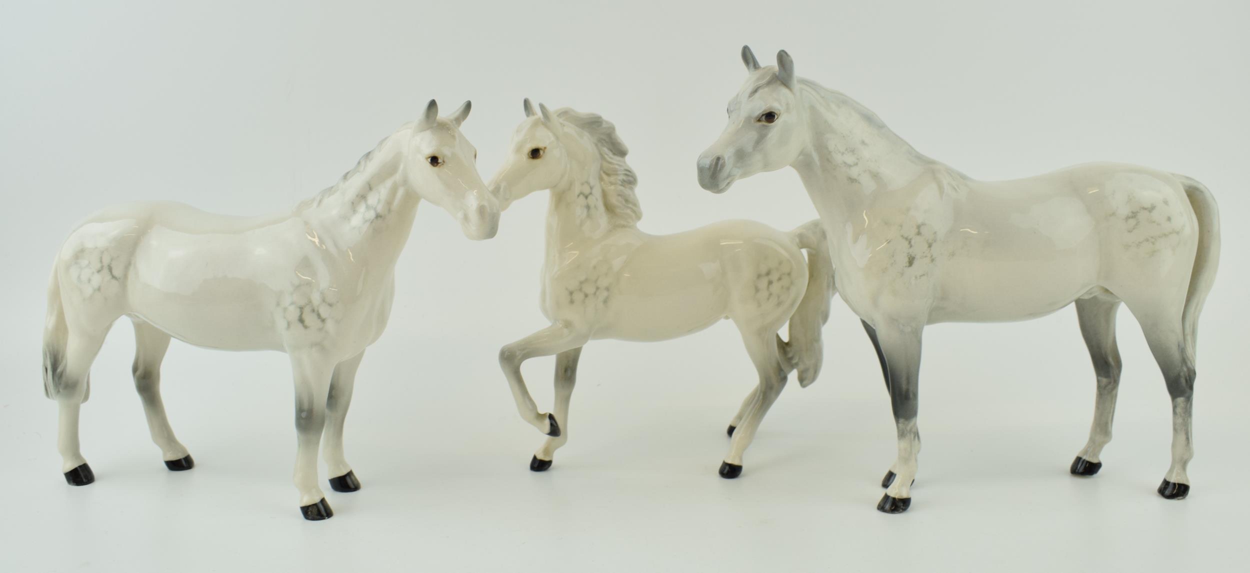 Beswick grey horses to include a prancing arab, an arab bahram and one other (3). In good