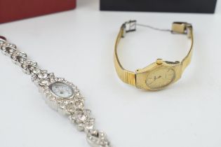 A pair of boxed lady's wristwatches to include a Pulsar gilt metal watch with a similar fashion