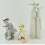 A Lladro figure of two nuns, 33cm tall, a Nao girl with a puppy and a Royal Doulton Follow Me figure