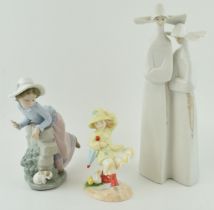 A Lladro figure of two nuns, 33cm tall, a Nao girl with a puppy and a Royal Doulton Follow Me figure