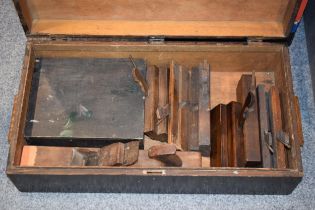 A collection of wooden block planes in a vintage wooden tool chest. 66cm x 36cm x 18cm In original