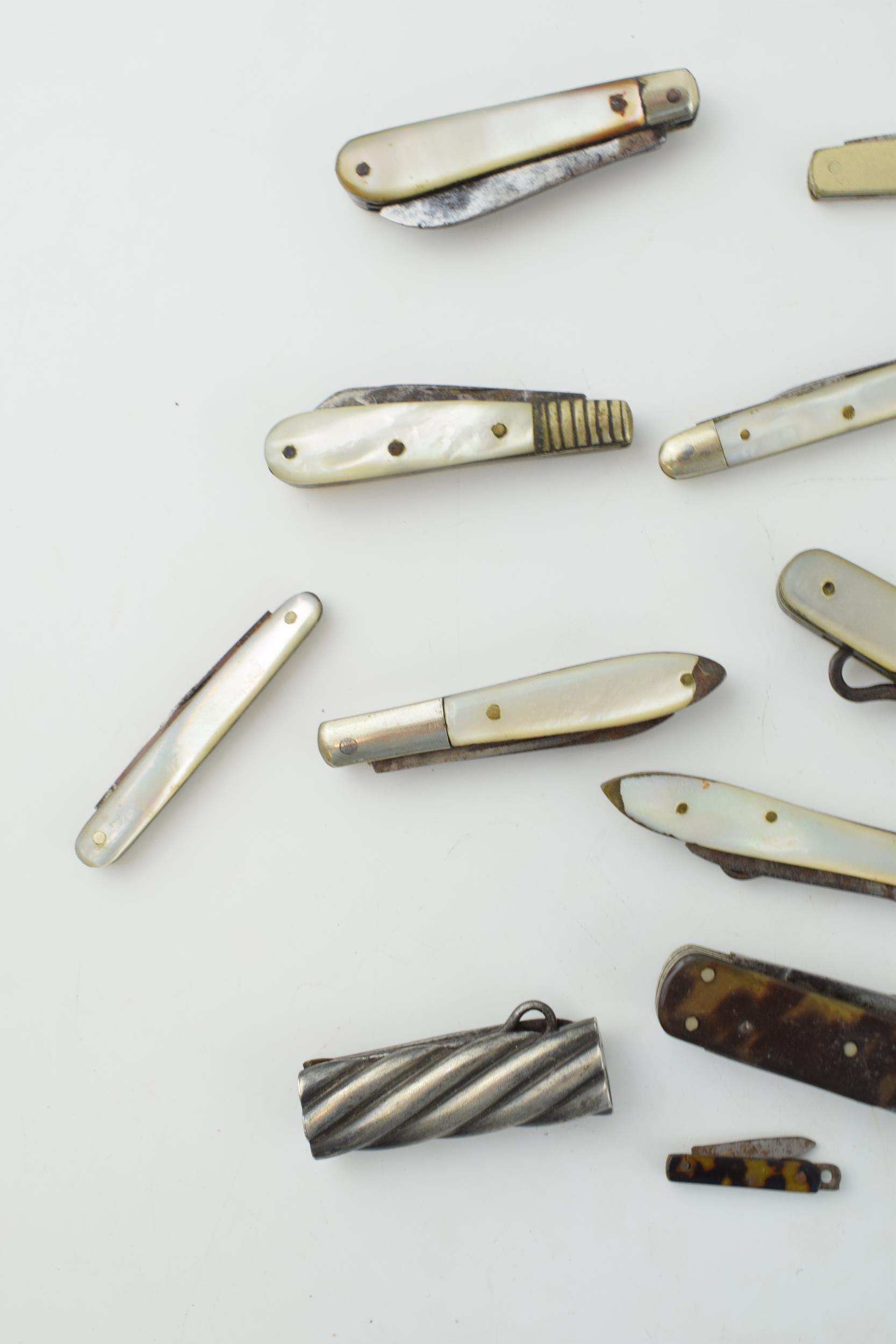 A collection of antique multifunction tool pocket knives to include mother pot pearl handled example - Image 8 of 9
