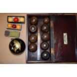 A set of indoor bowls by Henry A. Murton Ltd in lignum vitae in original box together with vintage