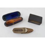 A collection of items to include an cased amber cigar holder, paper mâché snuff box and a vesta case