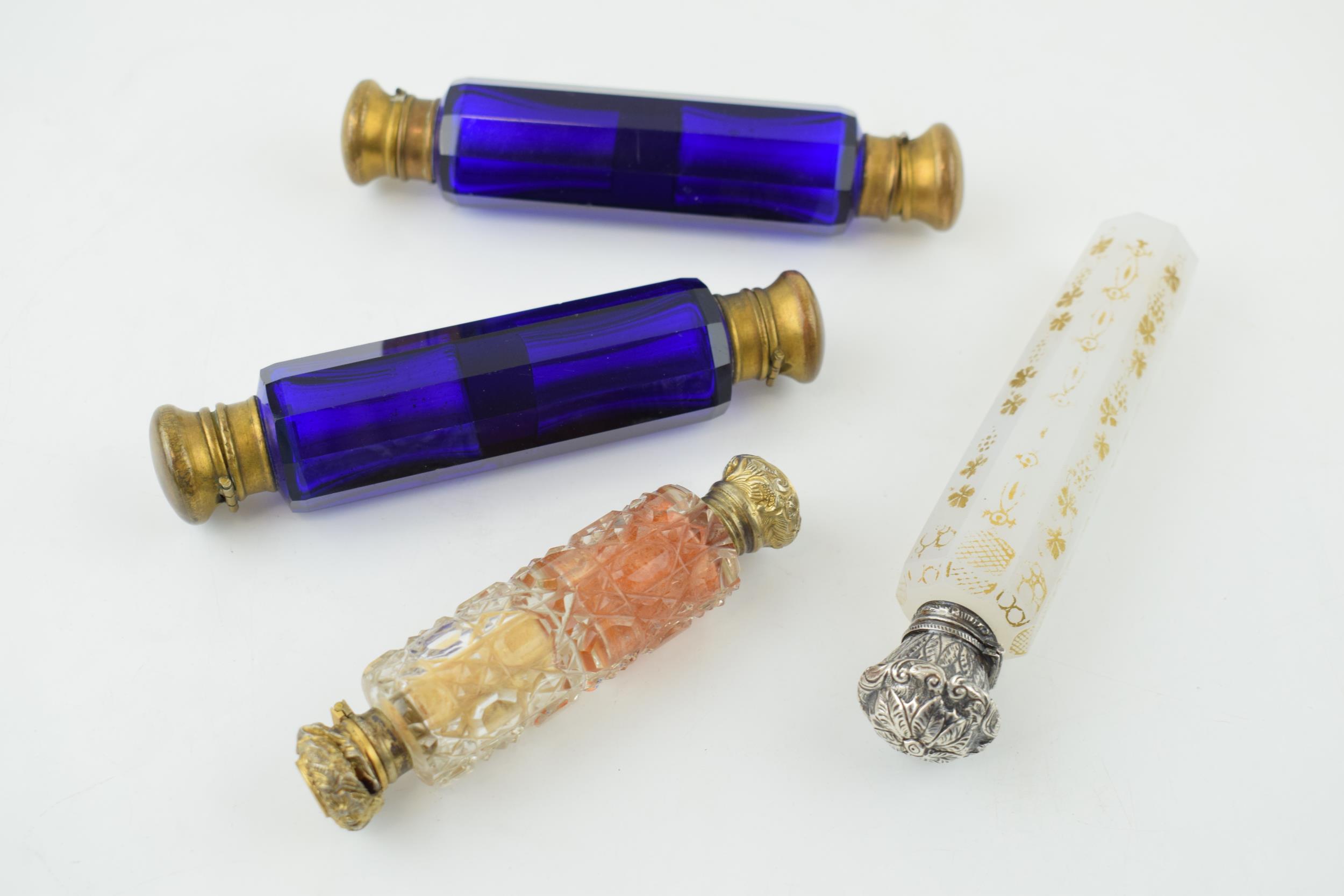 A collection of antique scent bottles to include double ended examples, in cut glass and Bristol