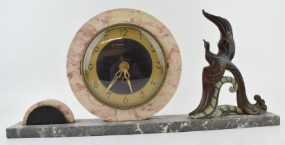 French Art Deco mantle clock, flanked by a large peacock, 50cm long.