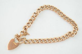 A 9ct gold bracelet with heart shaped padlock and safety chain. Weight 8.2 grams In good usable