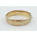 Hallmarked silver bangle, engraved decoration, 25.9 grams.