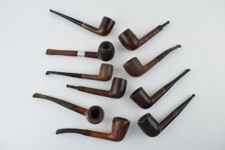 A collection of vintage tobacco smoking pipes to include briar examples by 'Kaywoodie', 'Nasta', '