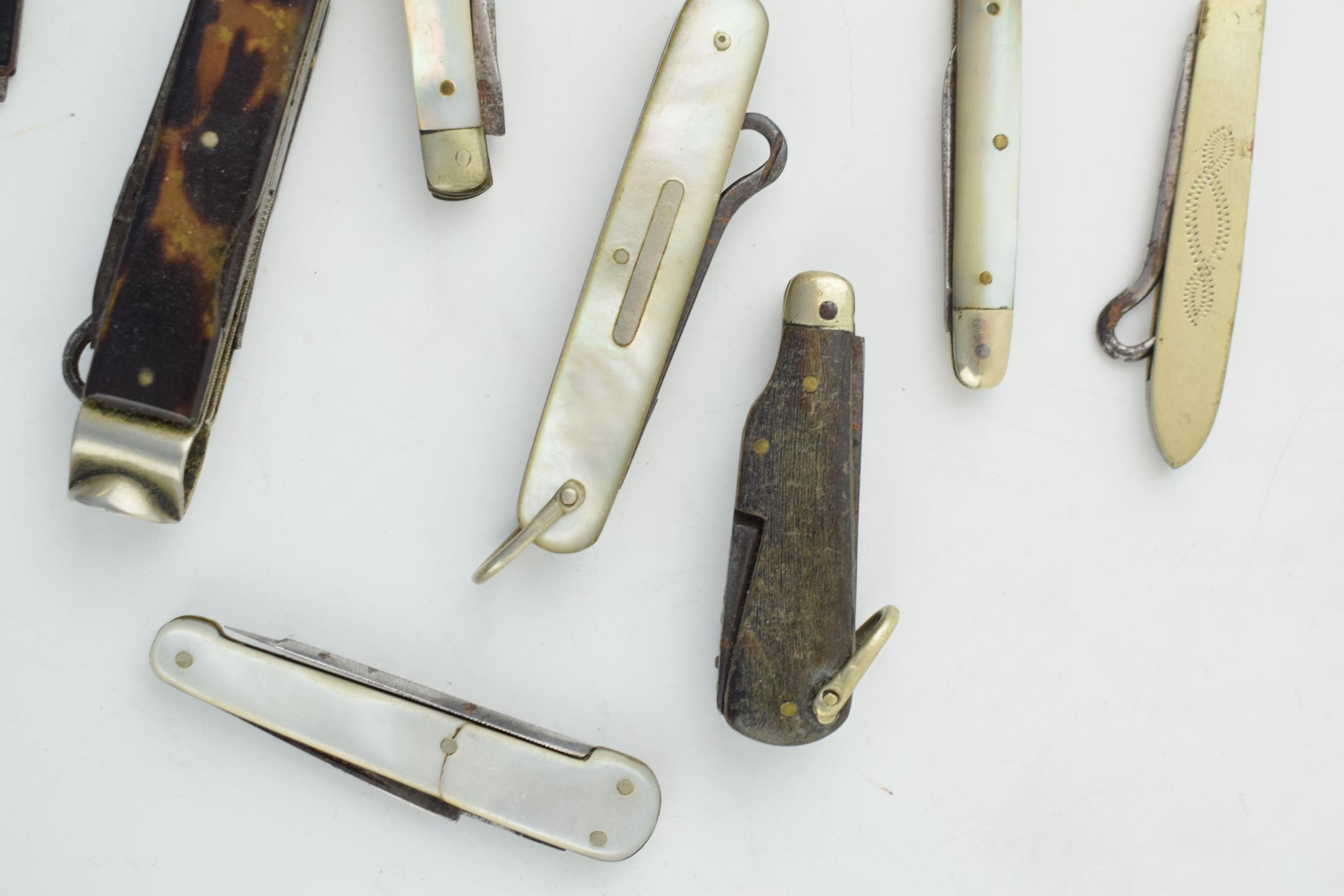 A collection of antique multifunction tool pocket knives to include mother pot pearl handled example - Image 2 of 9