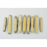 A collection of antique and vintage bone and celluloid handled pocket knives to include Sheffield