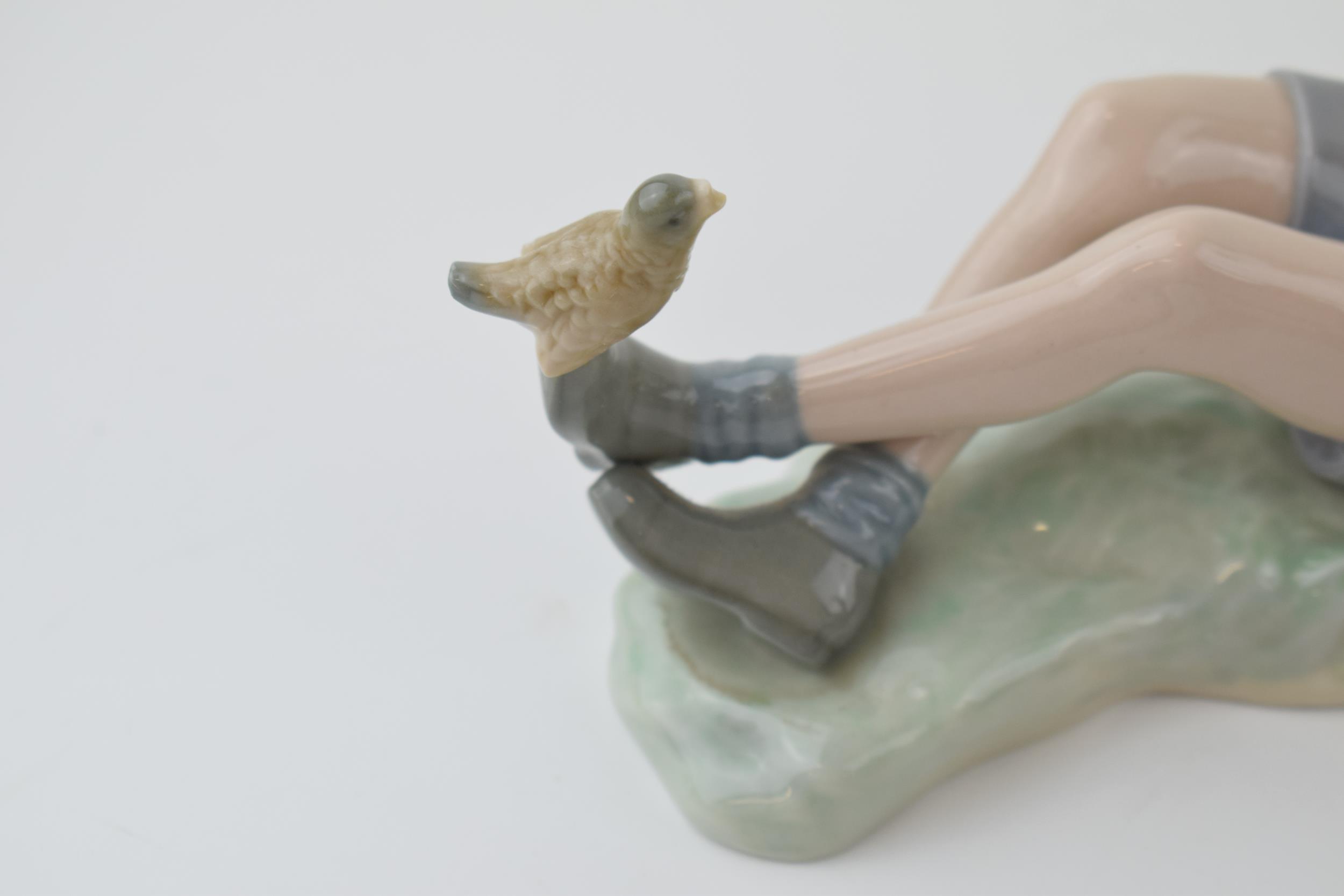 A trio of figures to include a Lladro boy with a bird on his foot (bird glued back), with a pair - Image 3 of 4