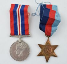 A WWII War Service medal together with 1939 - 1945 Star. (2) In good original condition.