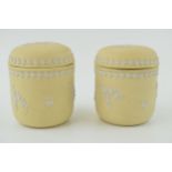 A pair of Wedgwood Jasperware in the yellow / prunus colour, lidded pots, 9.5cm tall. In good