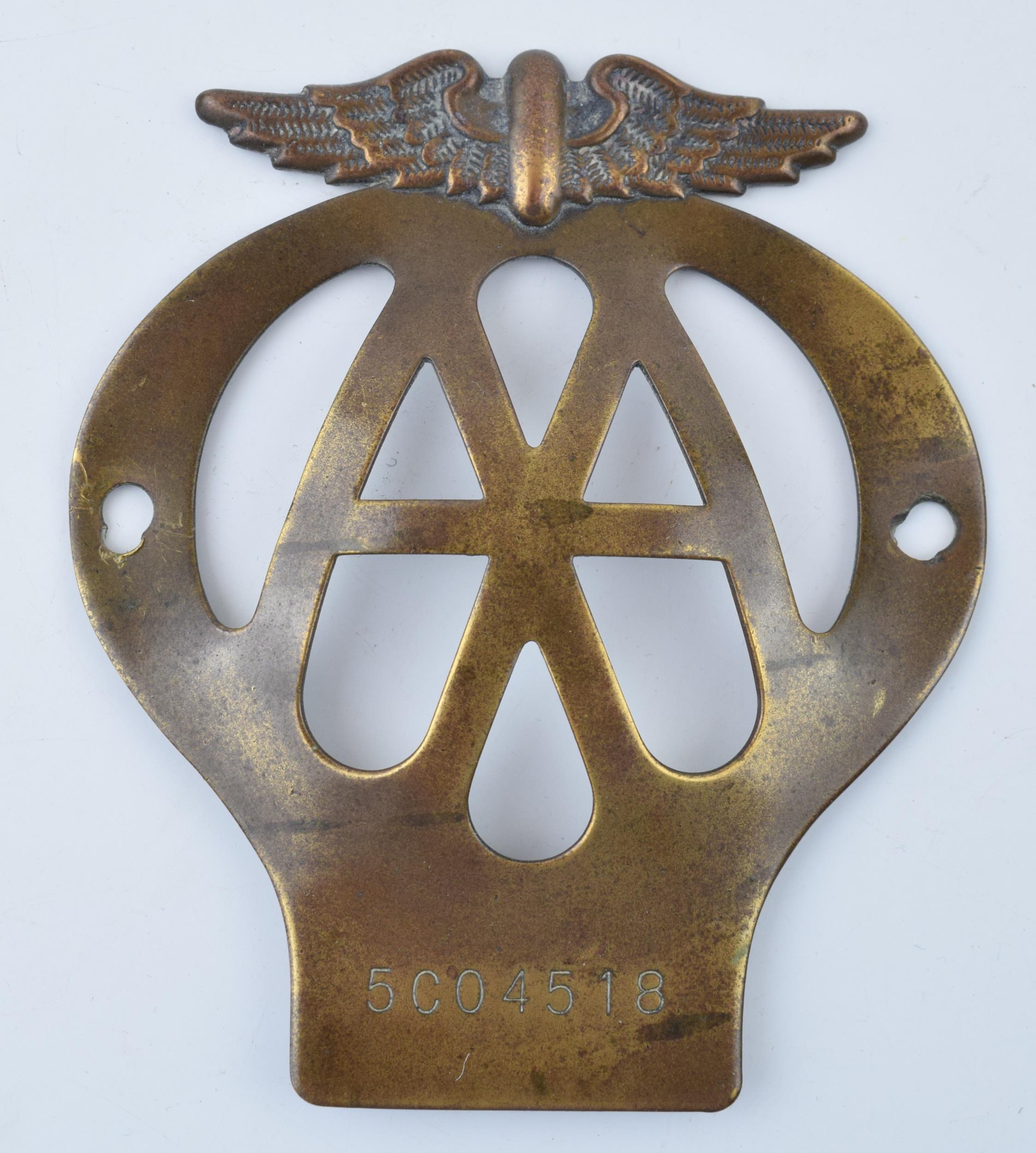 An early example of a brass AA badge No. 5C04518. 11cm. In good original condition with some wear