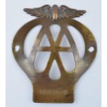 An early example of a brass AA badge No. 5C04518. 11cm. In good original condition with some wear