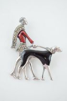 Sterling silver Art Deco style brooch of a lady walking her dog, with enamelled decoration, 5.5cm