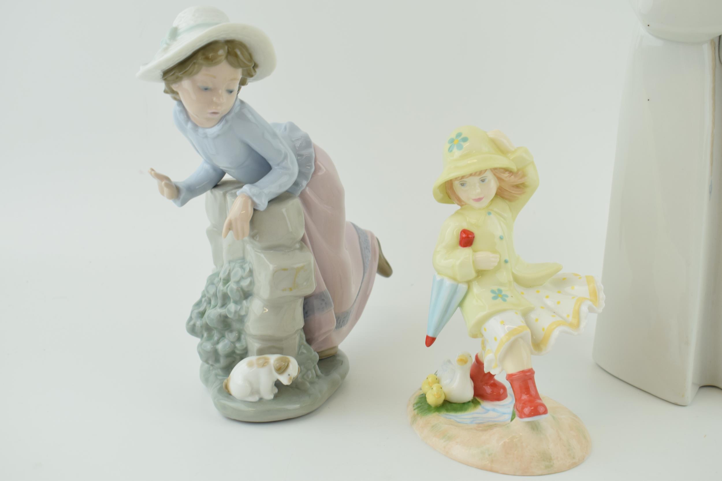 A Lladro figure of two nuns, 33cm tall, a Nao girl with a puppy and a Royal Doulton Follow Me figure - Image 3 of 3