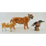 Damaged Beswick animals to include a tiger, a Guernsey cow and a kingfisher (3 - all damaged).