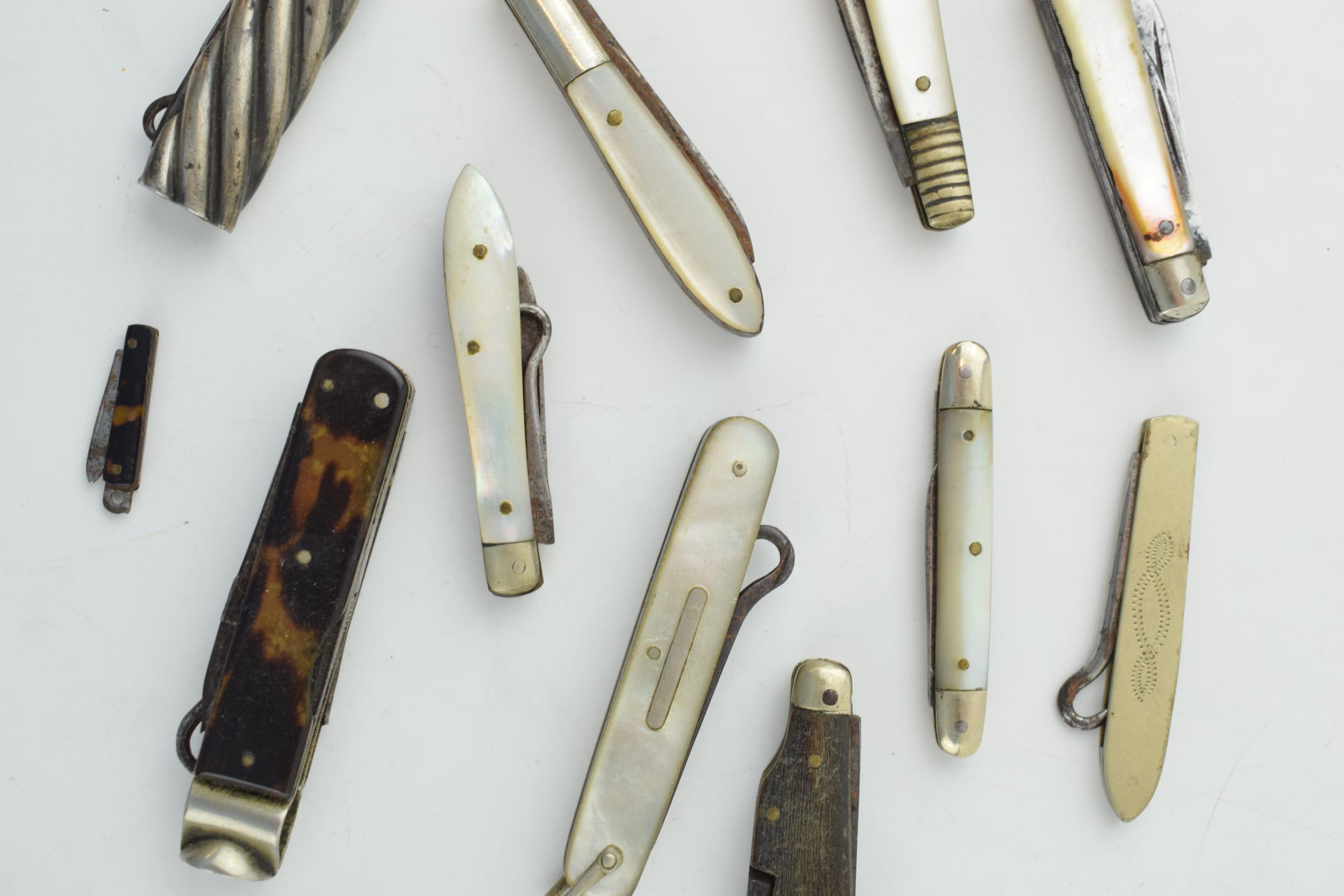 A collection of antique multifunction tool pocket knives to include mother pot pearl handled example - Image 3 of 9