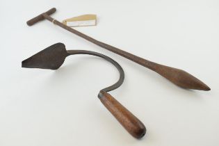 An antique metal dibble together with another wooden handled gardening / farming tool. Length