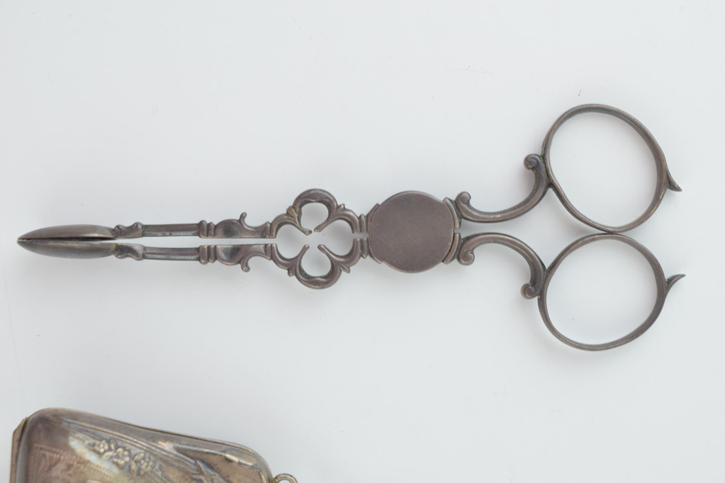 A pair of silver sugar nips, 36.2 grams, with a silver ladies purse with leather insert, gross - Image 2 of 4