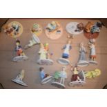 A collection of Coalport, Royal Worcester and similar children figures, some in the Treasury of