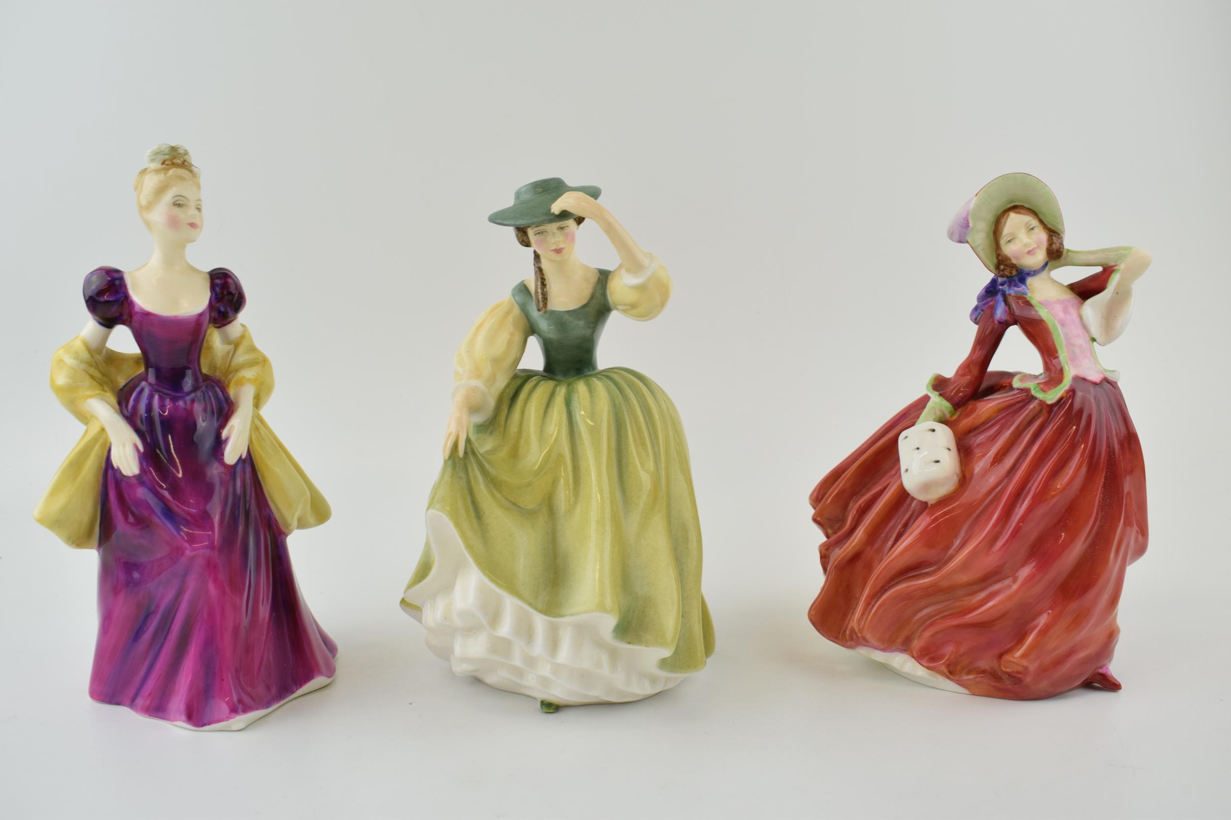 A collection of Royal Doulton figures to include 'Buttercup' HN 2309, 'Autumn Breezes' HN 934 and '