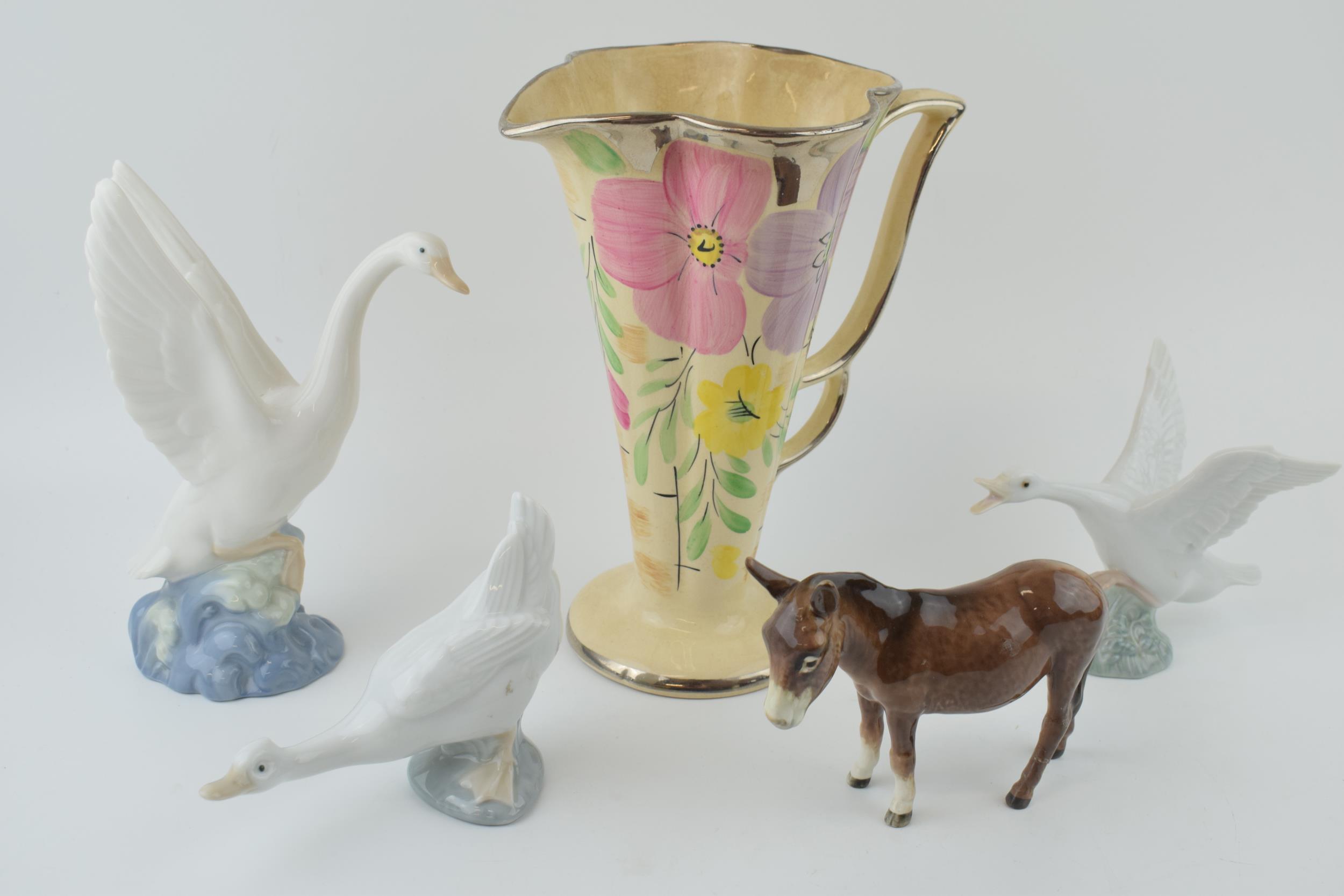 An Arthur Wood floral Art Deco vase with a Beswick donkey (af), with 2 Nao geese and a Lladro