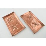 A pair of copper Arts and Crafts rectangular trays with embossed design and raised edges, 19.5cm x