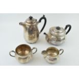 Hallmarked sterling silver tea set, Walker and Hall, Sheffield 1933, to include a teapot, a coffee