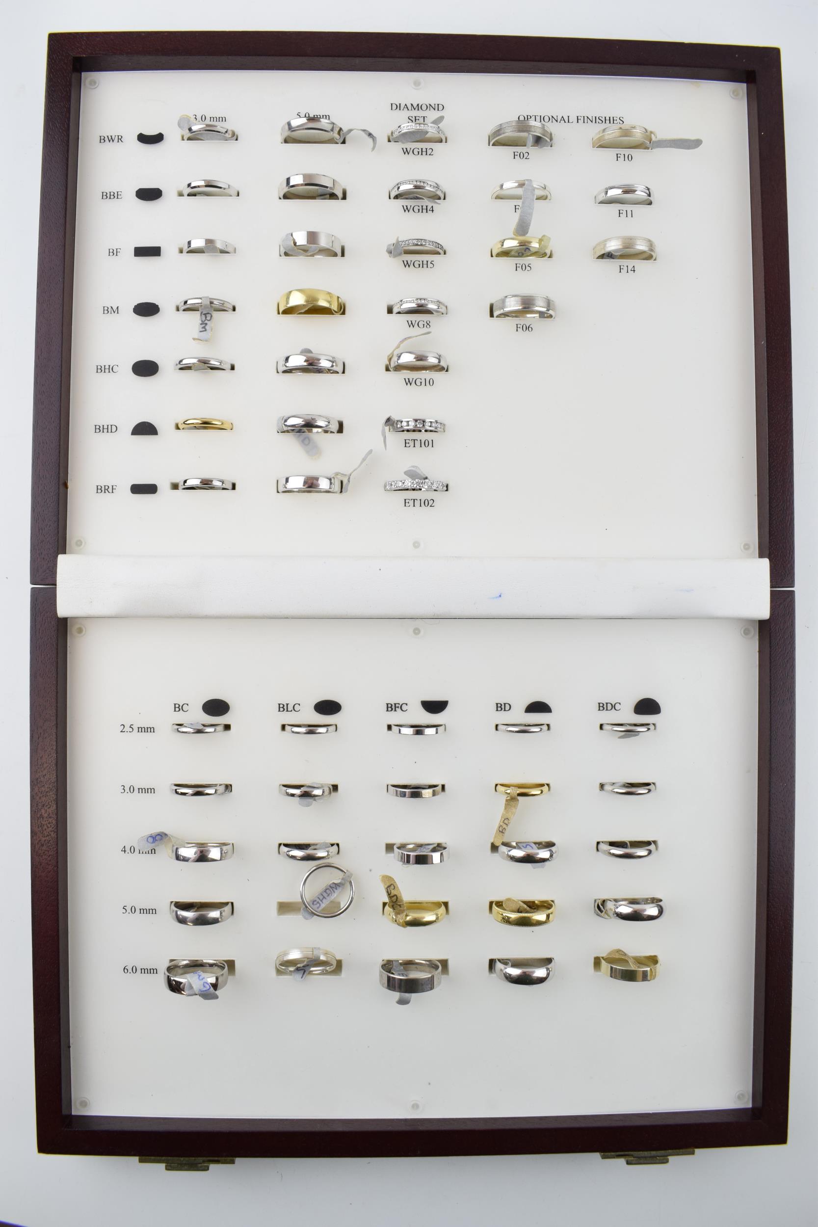 A jewellers sample box of rings, imitations, in associated box.