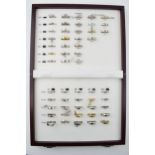 A jewellers sample box of rings, imitations, in associated box.