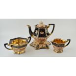 An early 20th century teaset, potentially Gibsons, to include a teapot, a stand, a sugar and a