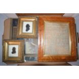 A 19th century sampler dated 1882 together with a pair of silhouettes. Items are in later frames.