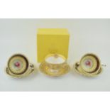 Three cups and saucers to include a boxed example by 'The Royal Collection' together with two '