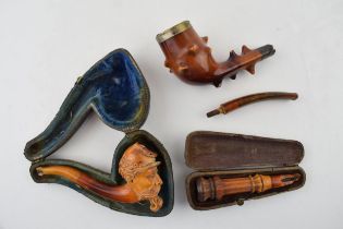 A collection of smoking related items to include a Briar pipe with hallmarked silver mount and amber