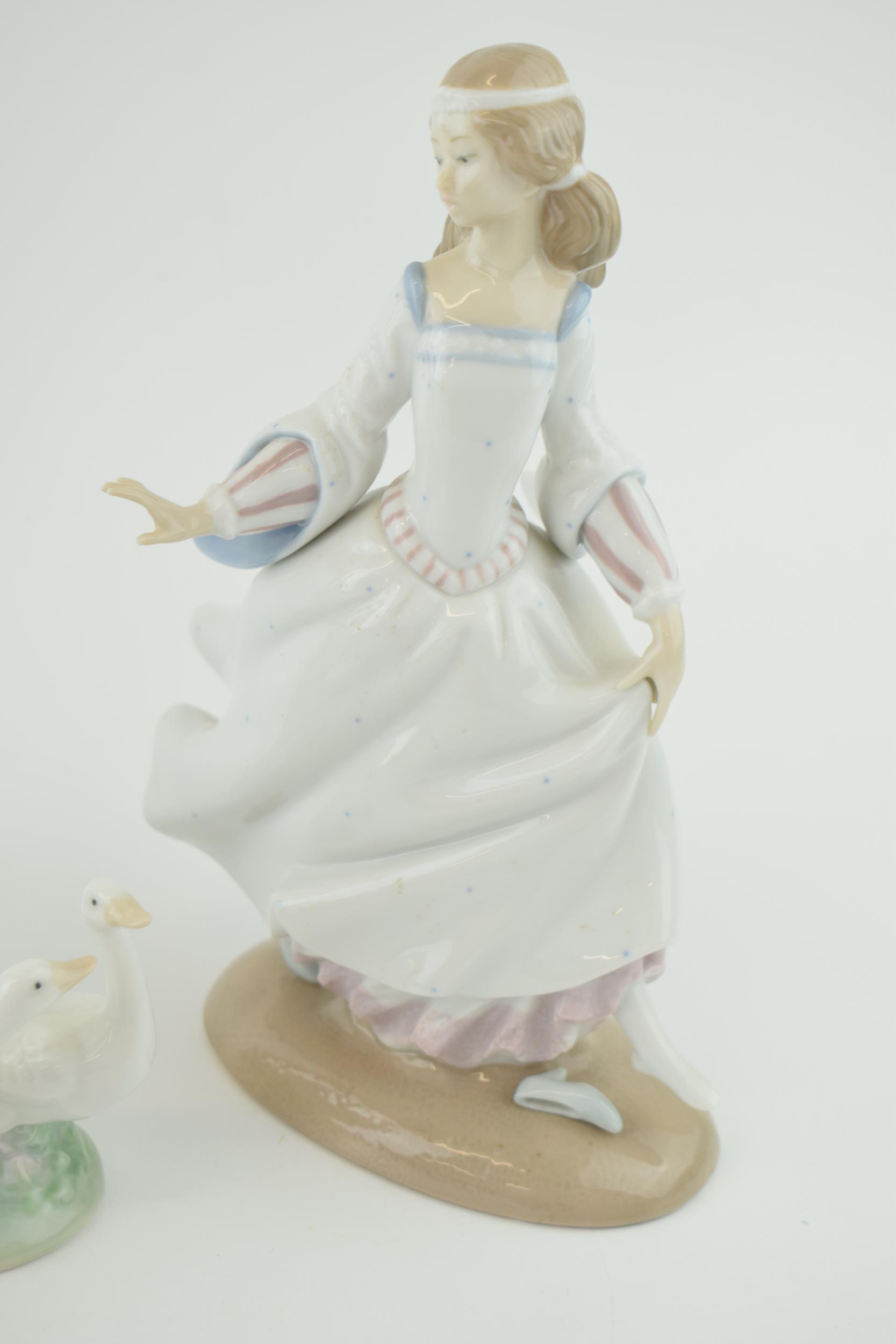 A trio of figures to include a Lladro girl 4820 with a Nao girl with geese and a girl in a frilly - Image 2 of 5