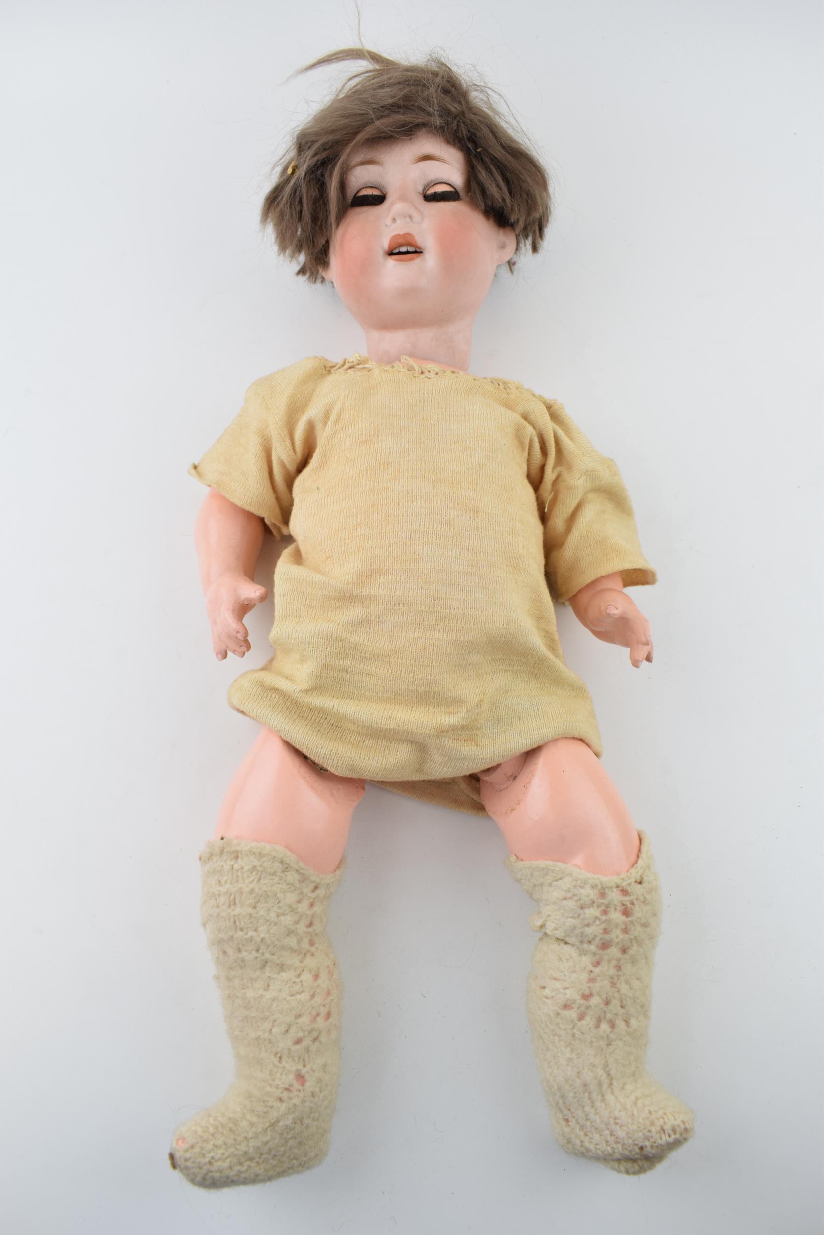 Bisque head doll marked WG possibly William Gobel, Head good requires re-stringing. Height 54cm.