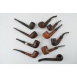 A collection of vintage tobacco smoking pipes to include briar examples by 'Invicta', 'Riseagle
